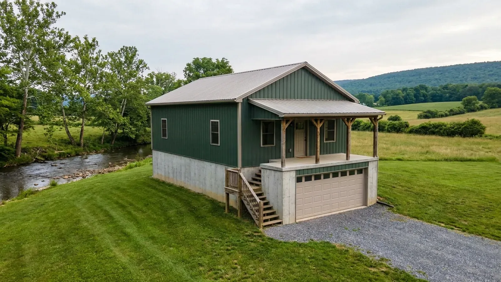 A barndominium raised on a stem-wall foundation with steps up to the entry and enclosed storage space beneath the elevated floor.