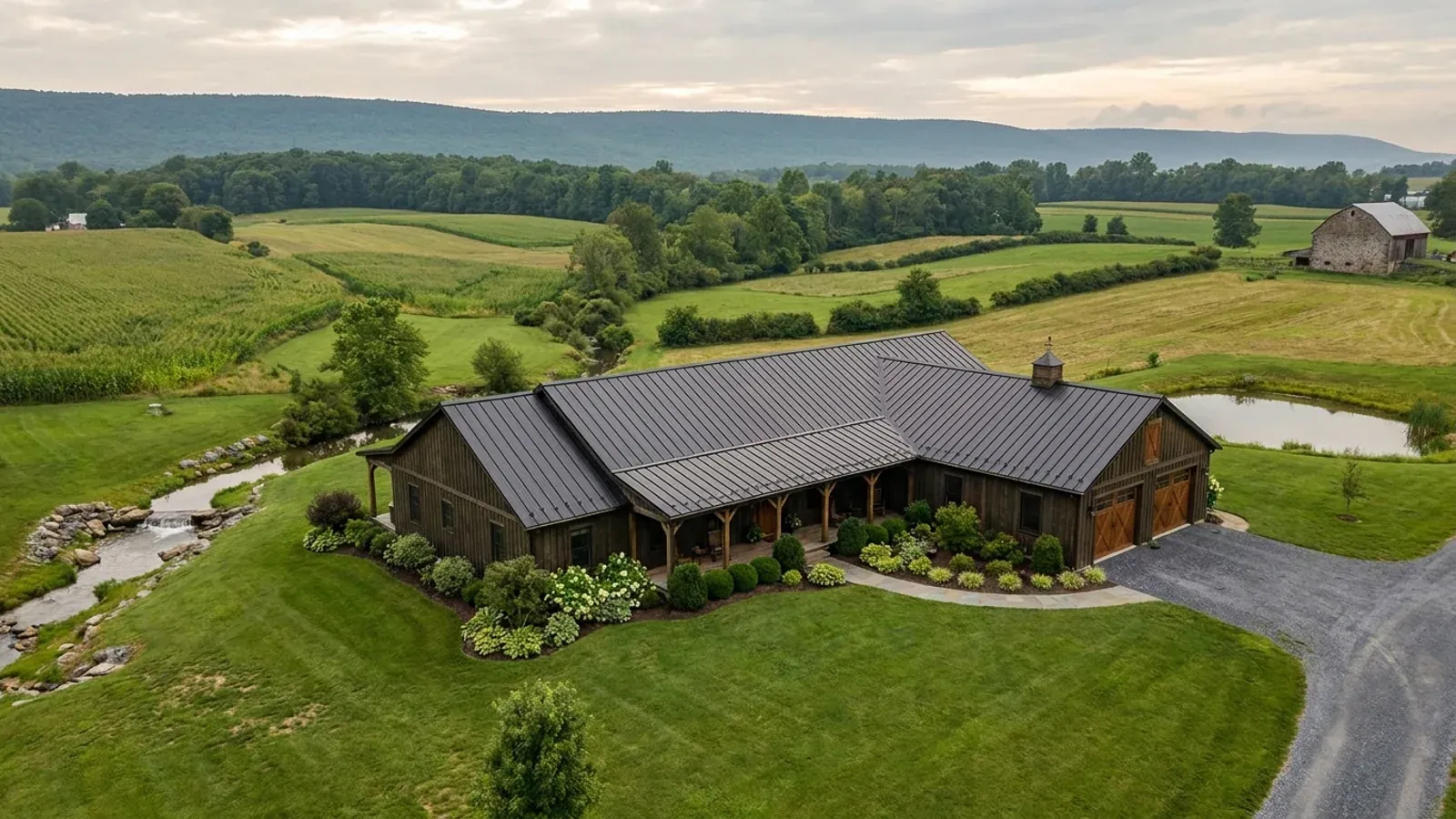 A completed single-story barndominium with a long, low roofline and no upper-level windows.